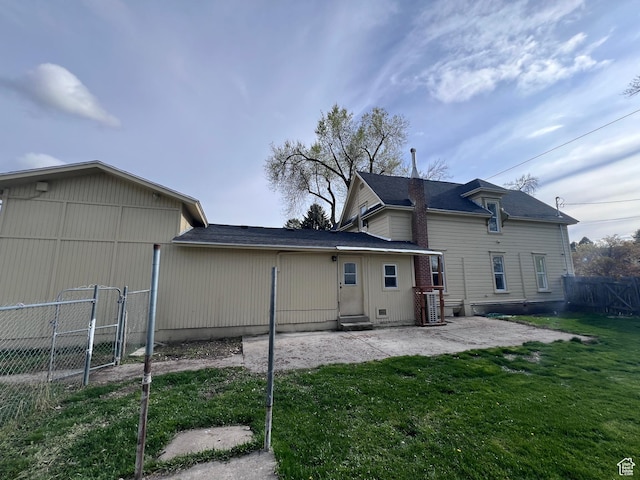 172 N 300 W, Logan, UT 84321 - rear view of house featuring a lawn, a gate, a patio area, fence, and entry steps