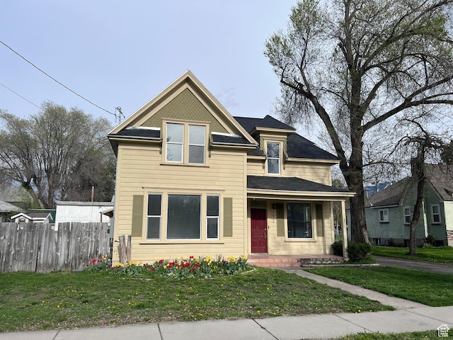 172 N 300 W, Logan, UT 84321 - traditional-style house featuring fence and a front lawn