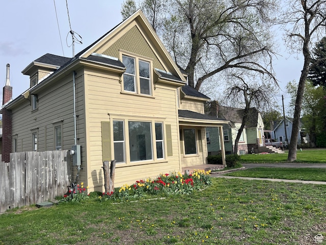 172 N 300 W, Logan, UT 84321 - view of front of home with fence and a front lawn
