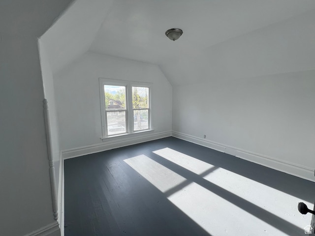 172 N 300 W, Logan, UT 84321 - bonus room with baseboards, dark wood-style flooring, and lofted ceiling