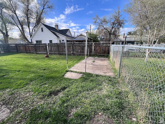172 N 300 W, Logan, UT 84321 - view of yard with a fenced backyard and a patio area