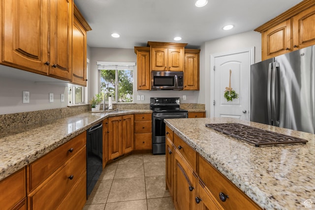 454 N 3550 W, Layton, UT 84041 - kitchen with black appliances, brown cabinetry, light stone countertops, light tile patterned floors, and recessed lighting
