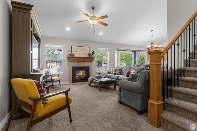 454 N 3550 W, Layton, UT 84041 - carpeted living area featuring stairway, a ceiling fan, a tiled fireplace, recessed lighting, and a chandelier