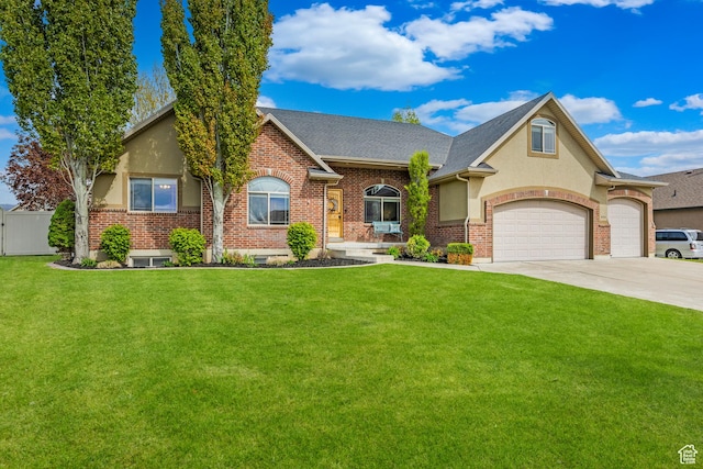 454 N 3550 W, Layton, UT 84041 - view of front facade featuring driveway, a garage, brick siding, stucco siding, and a shingled roof