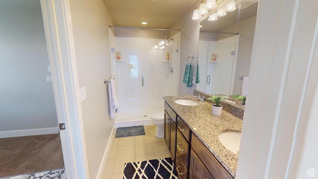 10627 S Lake Terrace Ave S, South Jordan, UT 84009 - full bathroom featuring a stall shower, toilet, double vanity, tile patterned flooring, and baseboards