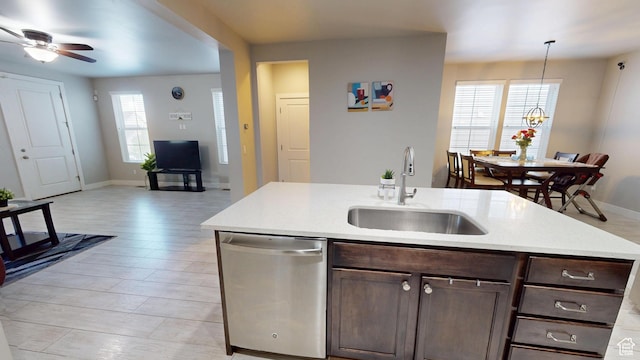 10627 S Lake Terrace Ave S, South Jordan, UT 84009 - kitchen with dishwasher, a sink, dark brown cabinets, and a ceiling fan