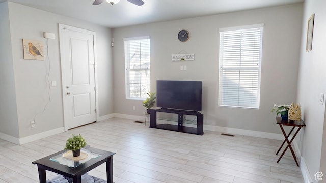 10627 S Lake Terrace Ave S, South Jordan, UT 84009 - living area with a ceiling fan, light wood-style floors, and baseboards