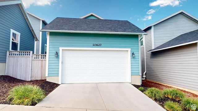 10627 S Lake Terrace Ave S, South Jordan, UT 84009 - garage featuring fence and concrete driveway