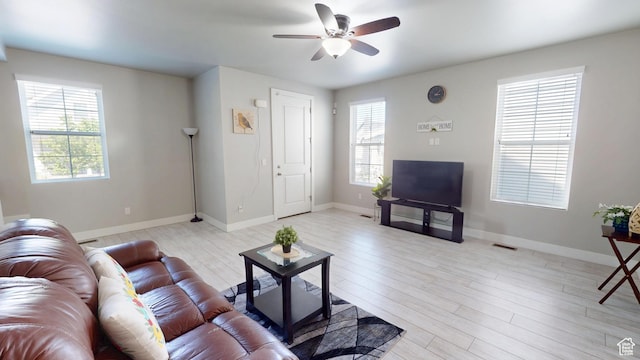 10627 S Lake Terrace Ave S, South Jordan, UT 84009 - living area with ceiling fan, light wood-type flooring, and baseboards
