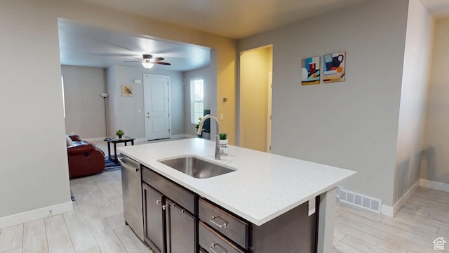 10627 S Lake Terrace Ave S, South Jordan, UT 84009 - kitchen featuring a sink, dark brown cabinetry, a ceiling fan, light countertops, and baseboards
