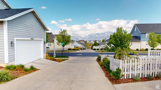 10627 S Lake Terrace Ave S, South Jordan, UT 84009 - view of concrete road with a residential view and a mountain view
