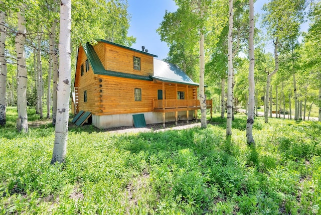 4417 Buck Way Unit 2029, Heber City, UT 84032 - back of house featuring log exterior, metal roof, and a deck