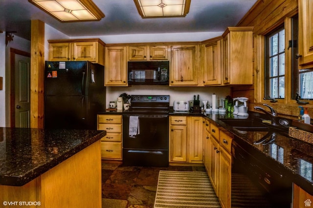 4417 Buck Way Unit 2029, Heber City, UT 84032 - kitchen with a sink, dark stone countertops, brown cabinets, and black appliances