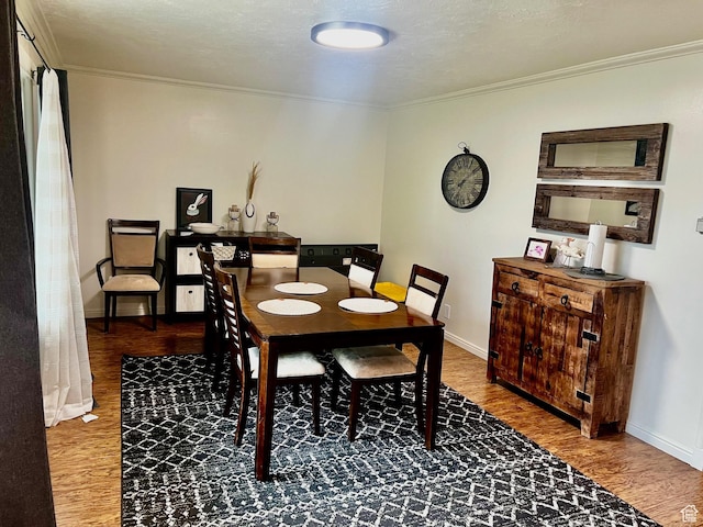 374 W 500 N, Logan, UT 84321 - dining room featuring crown molding, baseboards, and wood finished floors
