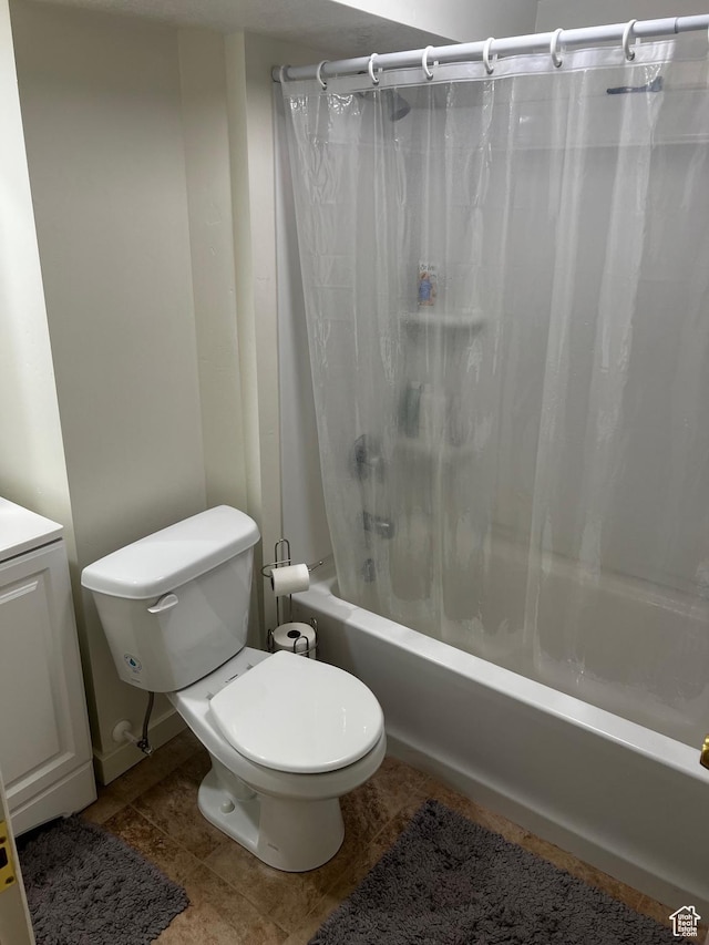 374 W 500 N, Logan, UT 84321 - bathroom with shower / bath combo with shower curtain, tile patterned flooring, and toilet