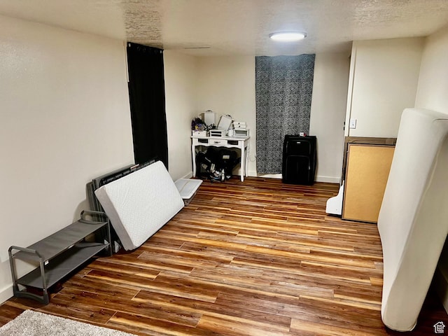 374 W 500 N, Logan, UT 84321 - miscellaneous room featuring a textured ceiling, baseboards, and wood finished floors