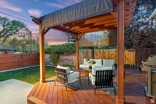 wooden terrace with a yard, a fenced backyard, and an outdoor hangout area