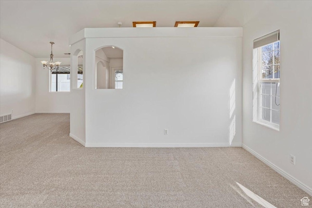 5448 S 4025 W, Roy, UT 84067 - empty room with carpet flooring, baseboards, an inviting chandelier, and visible vents