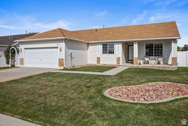 ranch-style home with a porch, a front yard, a garage, fence, and concrete driveway