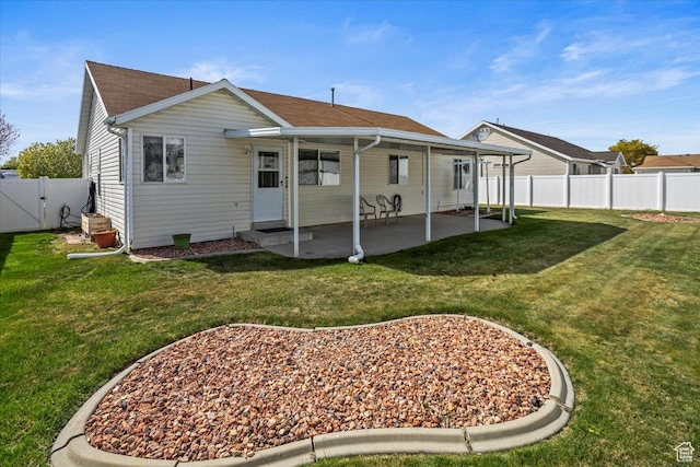 5448 S 4025 W, Roy, UT 84067 - rear view of house featuring a fenced backyard, a gate, a patio, and a lawn