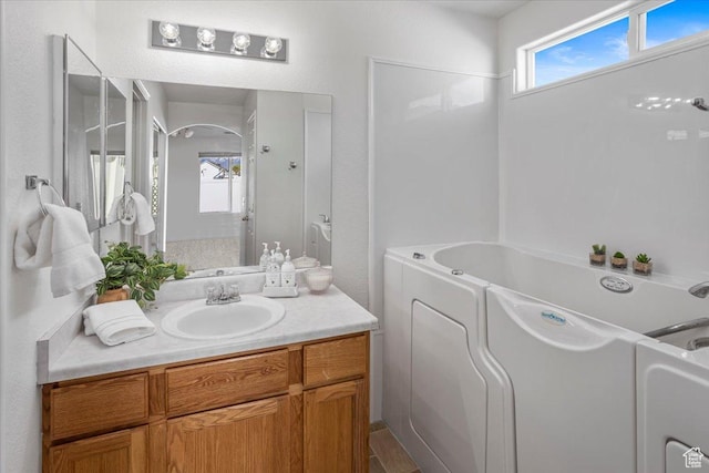 5448 S 4025 W, Roy, UT 84067 - bathroom featuring vanity and a bathtub