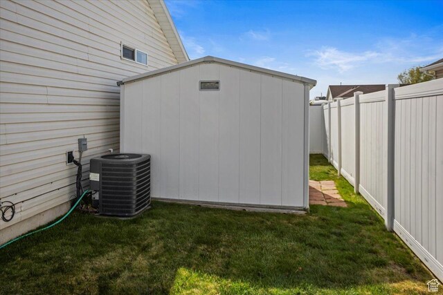 5448 S 4025 W, Roy, UT 84067 - view of shed featuring a fenced backyard and cooling unit