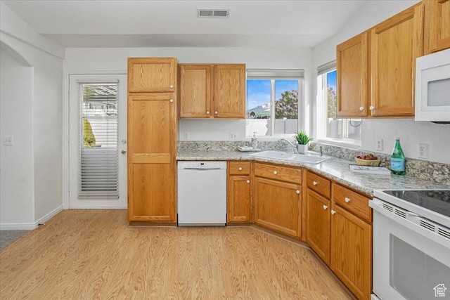 5448 S 4025 W, Roy, UT 84067 - kitchen with a sink, light wood-type flooring, white appliances, and a healthy amount of sunlight