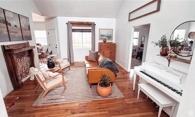 35 E 400 N, Moroni, UT 84646 - living room with baseboards, vaulted ceiling, wood finished floors, and a fireplace