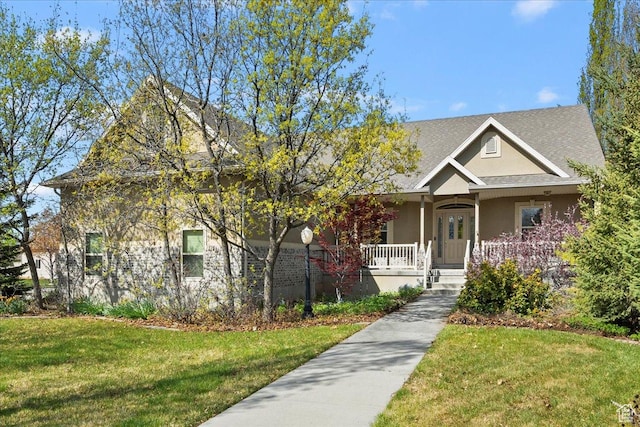 3072 S 1065 W, Syracuse, UT 84075 - view of front of home featuring a porch, a front yard, and stucco siding