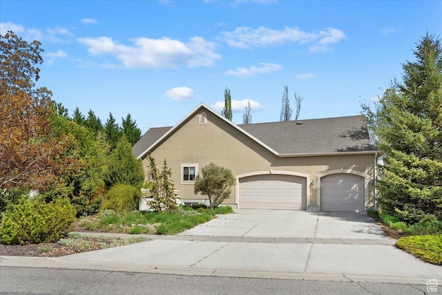 3072 S 1065 W, Syracuse, UT 84075 - view of front of home featuring an attached garage, driveway, and stucco siding