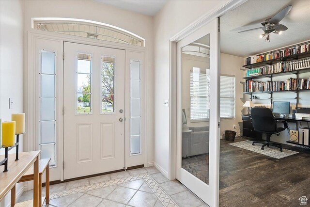 3072 S 1065 W, Syracuse, UT 84075 - foyer with ceiling fan, baseboards, and light tile patterned floors