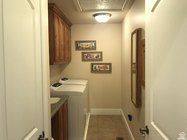 1003 E 200 S, American Fork, UT 84003 - laundry room featuring cabinet space, washer and clothes dryer, light tile patterned floors, and baseboards