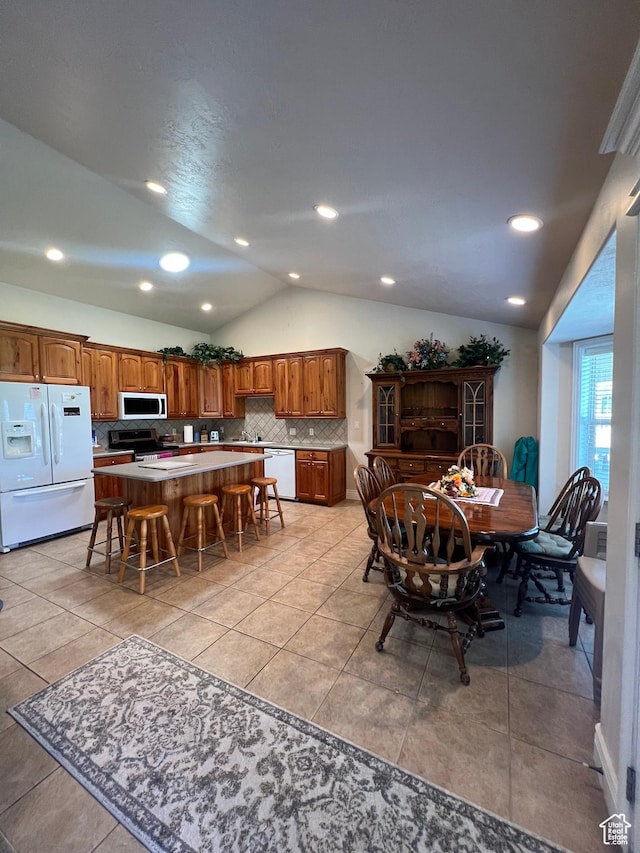 1003 E 200 S, American Fork, UT 84003 - dining room with vaulted ceiling, light tile patterned flooring, and recessed lighting