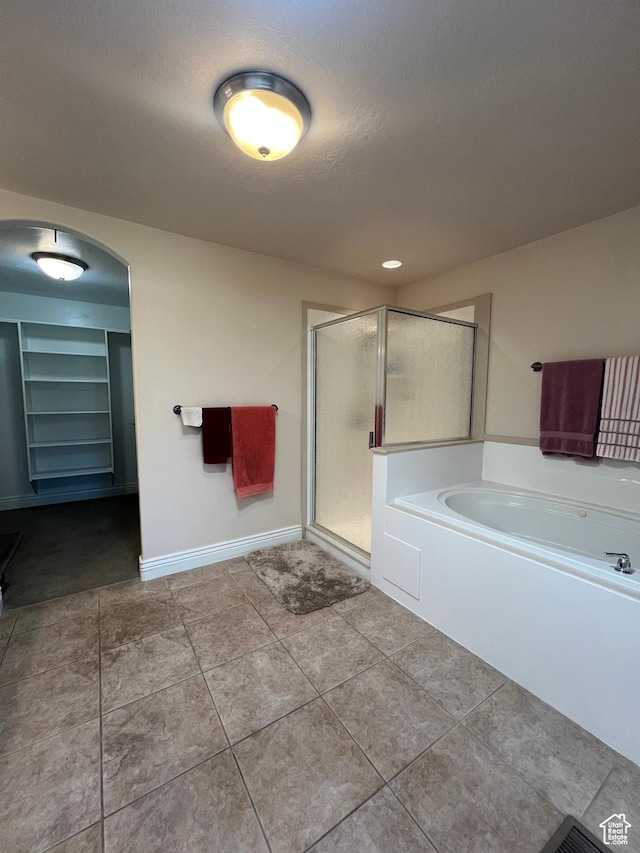 1003 E 200 S, American Fork, UT 84003 - full bathroom featuring a stall shower, tile patterned floors, a garden tub, baseboards, and built in features