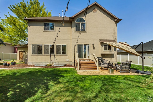 3381 W Slate View Dr, South Jordan, UT 84095 - rear view of house featuring fence, stucco siding, a lawn, and outdoor lounge area