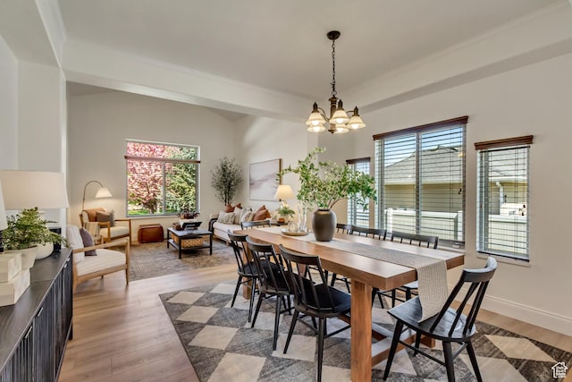 3381 W Slate View Dr, South Jordan, UT 84095 - dining space with an inviting chandelier, light wood finished floors, crown molding, and baseboards
