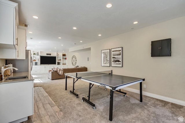3381 W Slate View Dr, South Jordan, UT 84095 - game room featuring light carpet, baseboards, recessed lighting, electric panel, and a sink