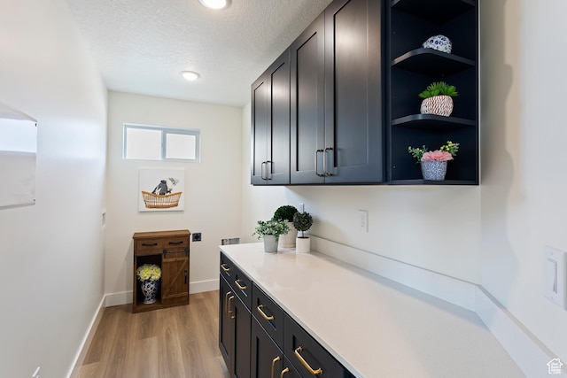 3238 S 4950 W, West Haven, UT 84401 - bar with light wood-style floors, recessed lighting, a textured ceiling, and baseboards