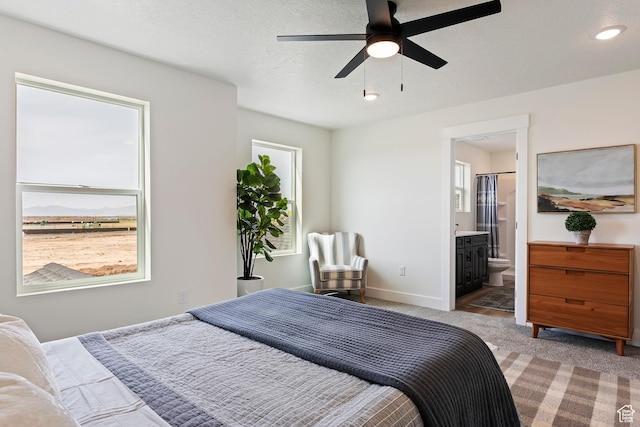 3238 S 4950 W, West Haven, UT 84401 - bedroom featuring baseboards, ensuite bathroom, light carpet, and a ceiling fan