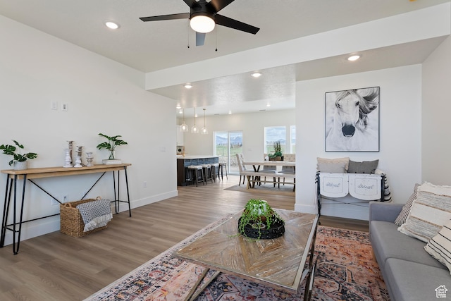 3238 S 4950 W, West Haven, UT 84401 - living room featuring light wood-style floors, baseboards, ceiling fan, and recessed lighting