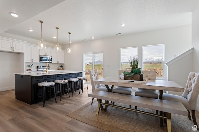 3238 S 4950 W, West Haven, UT 84401 - dining space with recessed lighting, light wood-style flooring, and a wealth of natural light