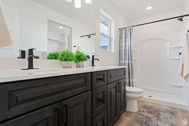 3238 S 4950 W, West Haven, UT 84401 - full bathroom featuring double vanity, wood finished floors, toilet, a shower stall, and a sink