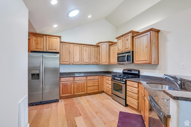 487 W 350 S Unit D, Springville, UT 84663 - kitchen with visible vents, a sink, dark stone countertops, stainless steel appliances, and light wood-style flooring