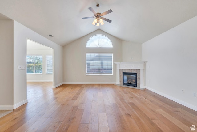 487 W 350 S Unit D, Springville, UT 84663 - unfurnished living room featuring lofted ceiling, a tile fireplace, light wood-style flooring, and visible vents