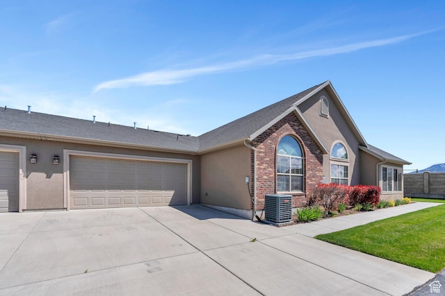 487 W 350 S Unit D, Springville, UT 84663 - ranch-style house featuring a garage, fence, cooling unit, stucco siding, and concrete driveway