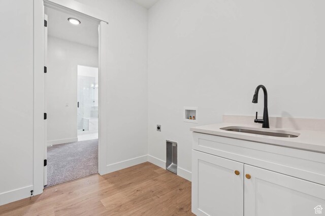 1851 W View Cv W, Santaquin, UT 84655 - laundry room with cabinet space, a sink, hookup for a washing machine, light wood-style flooring, and hookup for an electric dryer