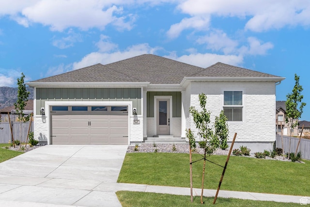 1851 W View Cv W, Santaquin, UT 84655 - view of front facade with fence, board and batten siding, concrete driveway, and a garage