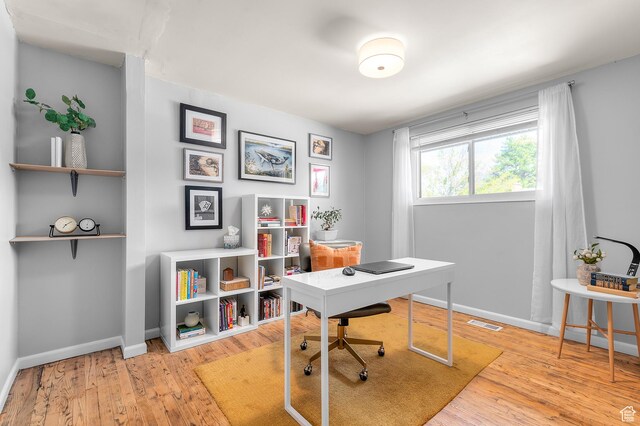 6888 S 455 E, Midvale, UT 84047 - office area featuring baseboards, hardwood / wood-style floors, and visible vents