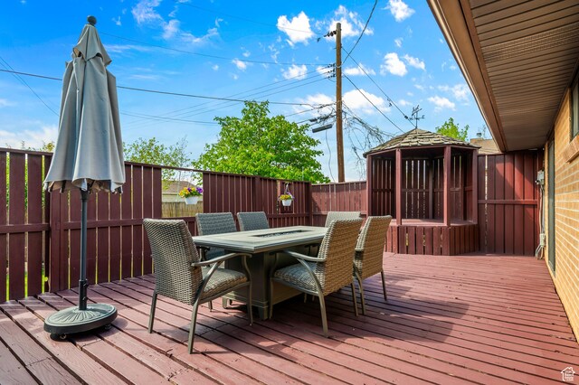 6888 S 455 E, Midvale, UT 84047 - wooden deck featuring a fenced backyard, a gazebo, and outdoor dining area