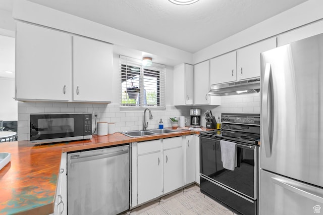 6888 S 455 E, Midvale, UT 84047 - kitchen featuring a sink, wood counters, tasteful backsplash, under cabinet range hood, and black appliances